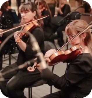 Violinists performing at the Grand Egyptian Museum concert